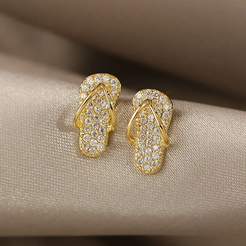 金色のグリッター フリップフロップ型イヤリング