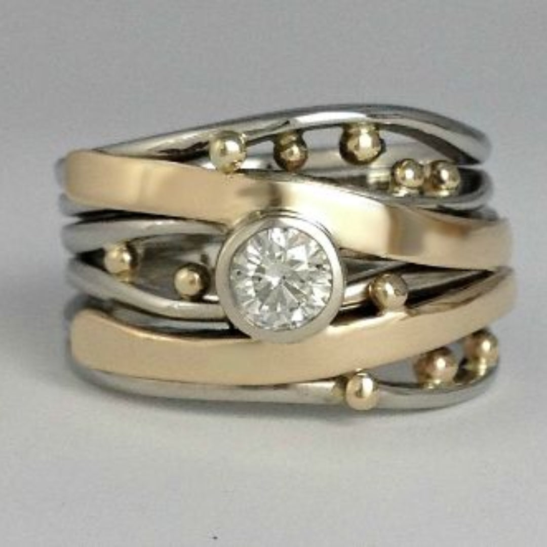 シルバーとゴールドのベゼルラップリング
