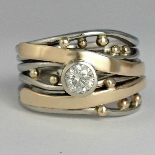 シルバーとゴールドのベゼルラップリング