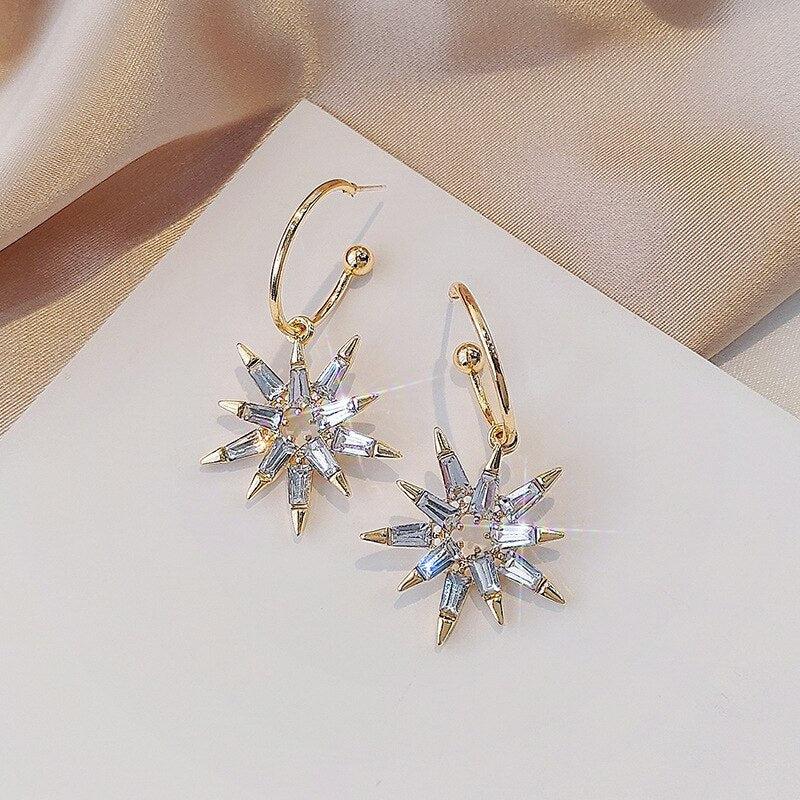 金と銀の星形ピアス