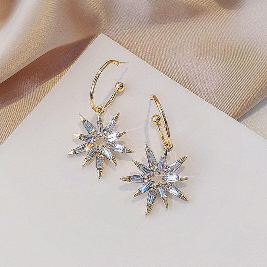 金と銀の星形ピアス